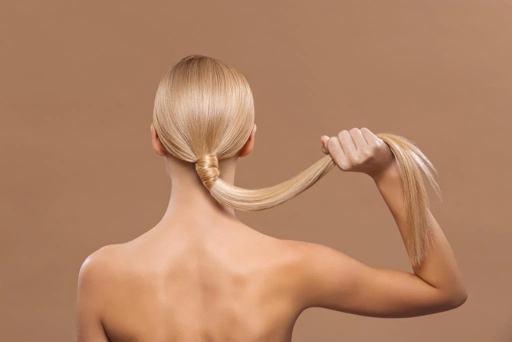 Woman with blonde hair showing smooth, shiny results after a Royal Hair Botox treatment at Franck Provost Sydney